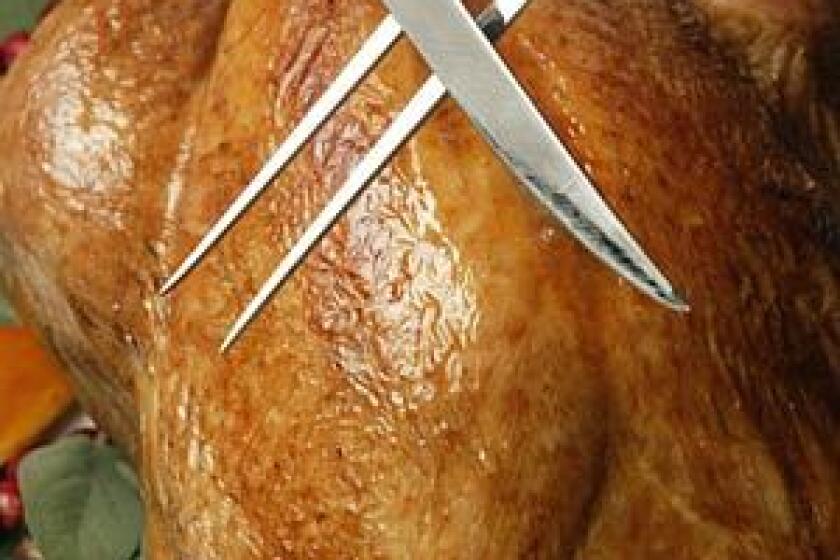 His Laguiole carving set guarantees him the primo Thanksgiving task: slicing the turkey.