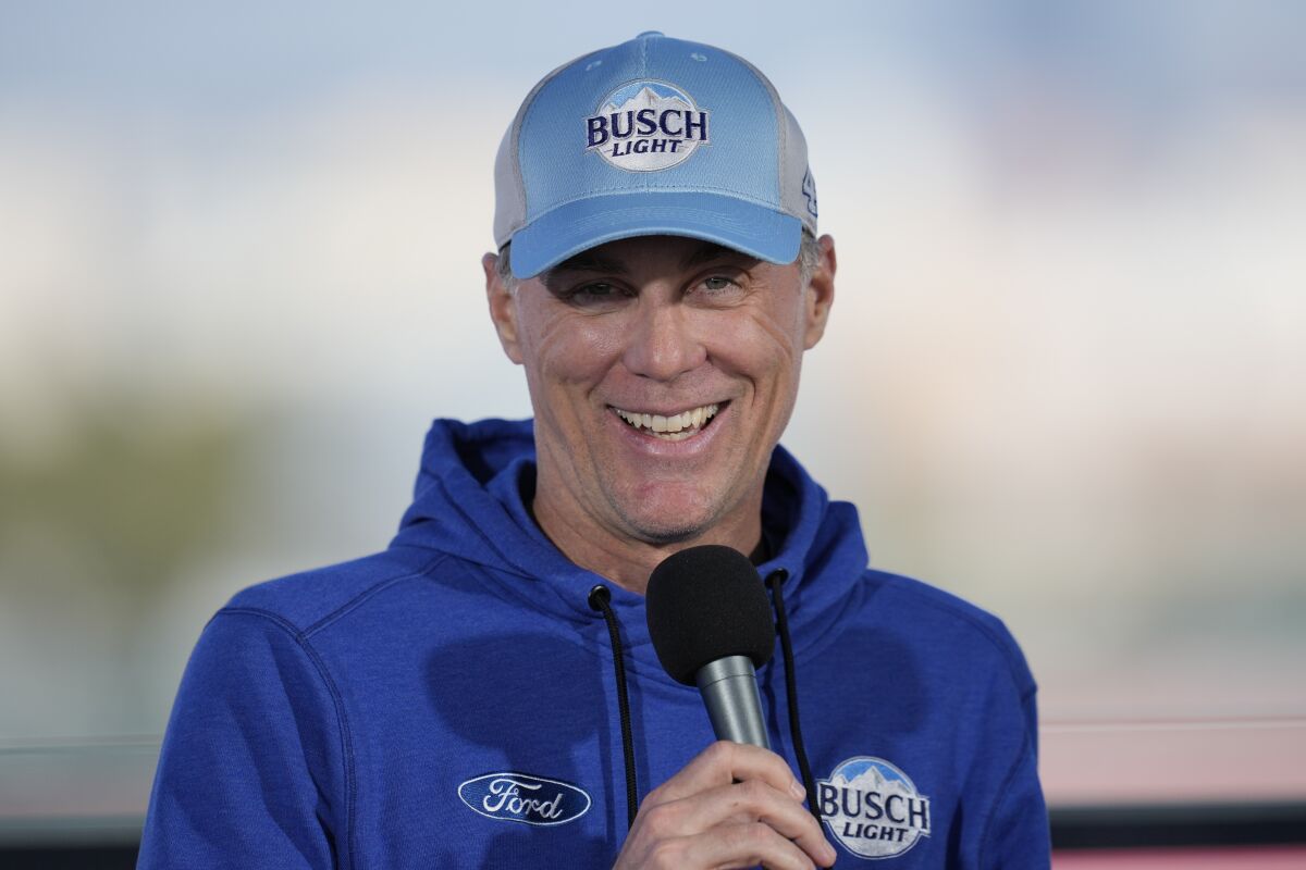 NASCAR Cup Series driver Kevin Harvick (4) speaks to reporters ahead of practice sessions before a NASCAR exhibition auto race at Los Angeles Memorial Coliseum, Saturday, Feb. 4, 2023, in Los Angeles. (AP Photo/Ashley Landis)