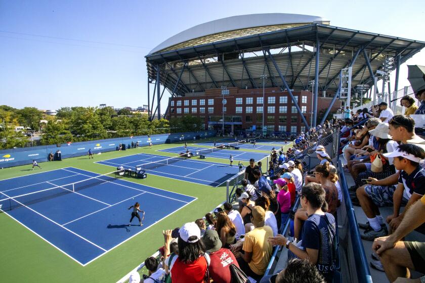NEW YORK, USA, August 27. Spectators watching Serena Williams of the United States during a practice session on the practice courts with a backdrop of Arthur Ashe Stadium in preparation for the US Open Tennis Championship 2022 at the USTA National Tennis Centre on August 27th 2022 in Flushing, Queens, New York City. (Photo by Tim Clayton/Corbis via Getty Images)