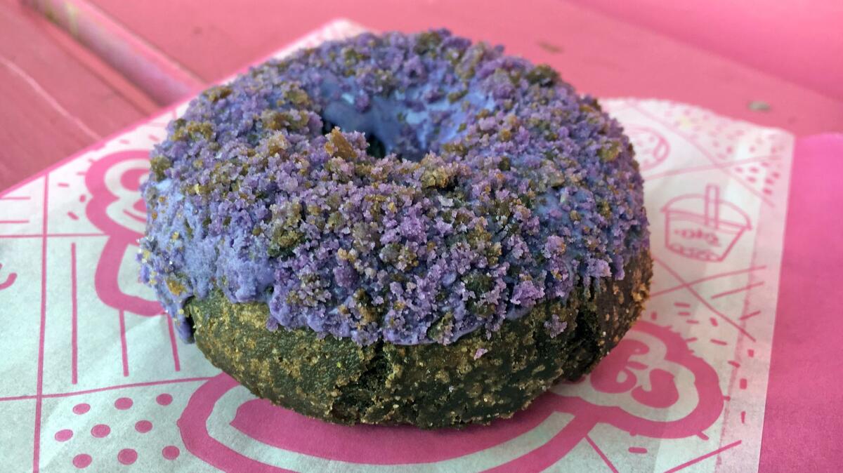 Ube doughnut from DK's Donuts. (Jenn Harris / Los Angeles Times)