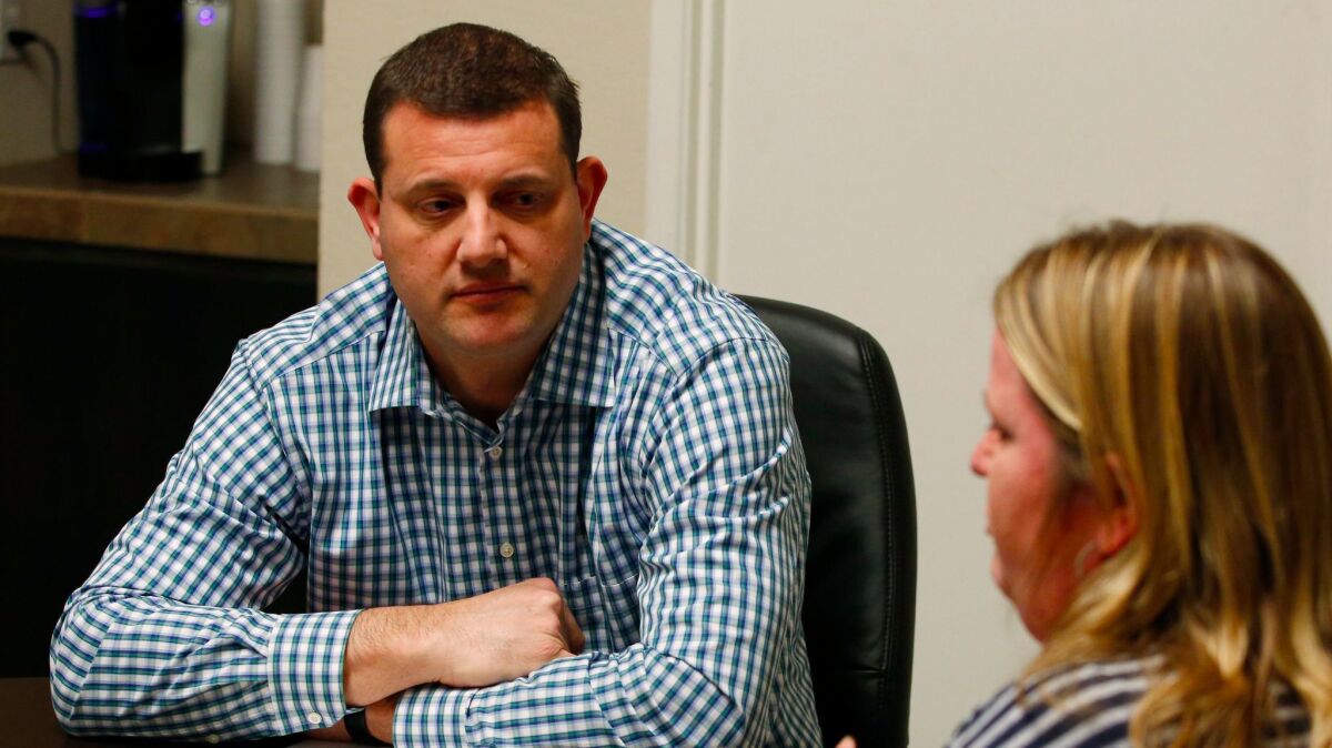 Rep. David Valadao (R-Hanford) meets a constituent during district meetings last month. The last two GOP presidential candidates lost in his district by double digits.