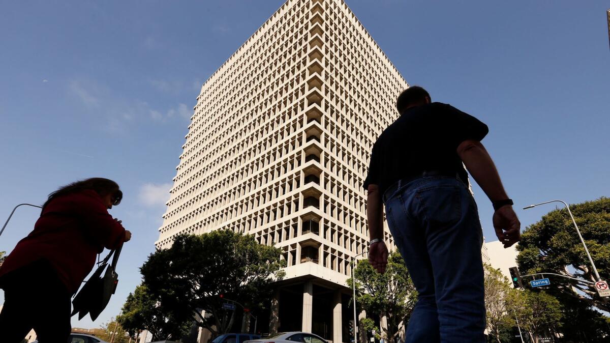 L.A. County supervisors are expected to consider a motion that would end the practice of charging a $50 registration to criminal defendants seeking representation by a public defender or court-appointed counsel. Above, the Clara Shortridge Foltz Criminal Justice Center.