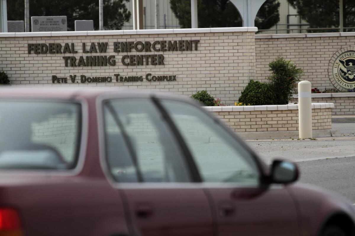 A car enters the Federal Law Enforcement Training Center in Artesia, N.M., which is serving as a detention facility for adult immigrants who entered the country illegally accompanied by children.