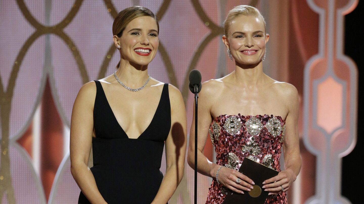 Sophia Bush, left, and Kate Bosworth present an award onstage.