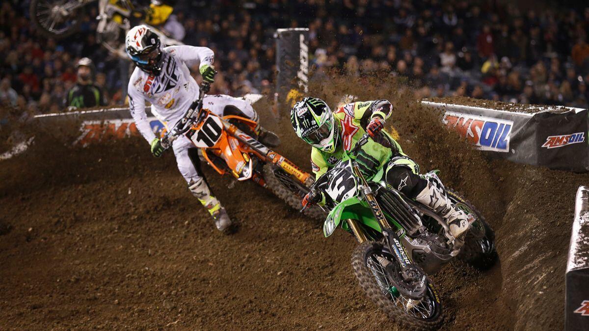 Eli Tomac is pursued by Justin Brayton in the 450SX main event at the Monster Energy AMA Supercross at Angel Stadium on Jan. 23, 2016. Tomac placed third and Brayton placed 4th.