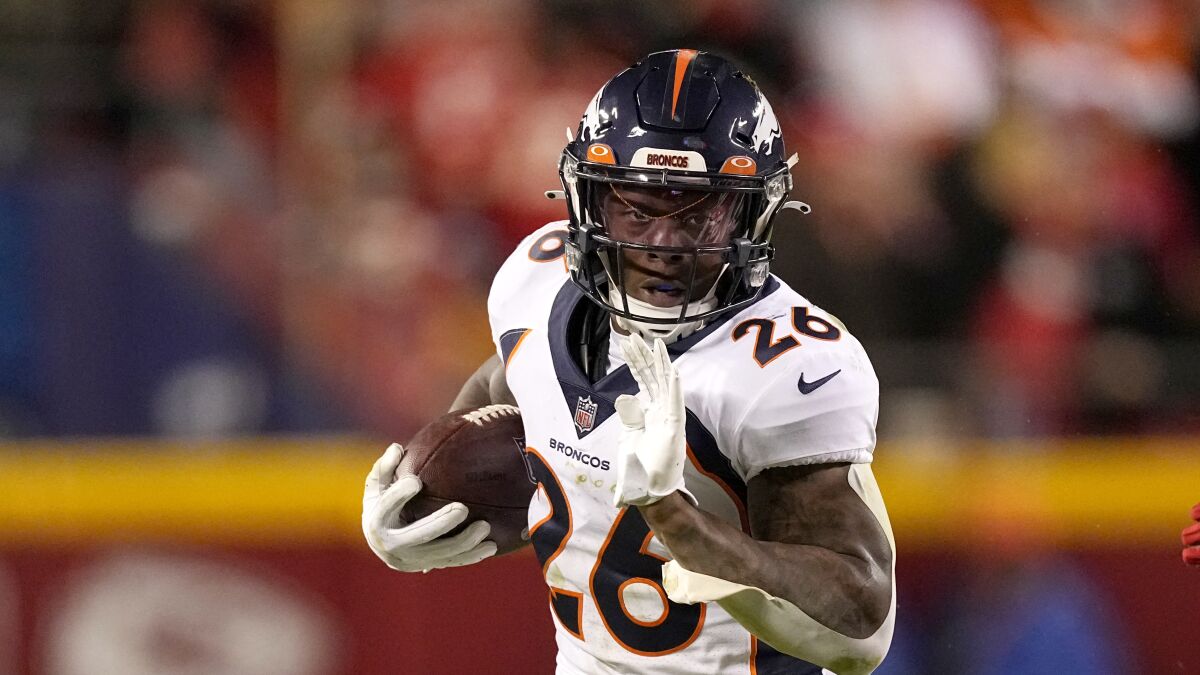 Denver Broncos running back Mike Boone carries the ball against the Kansas City Chiefs on Dec. 5.
