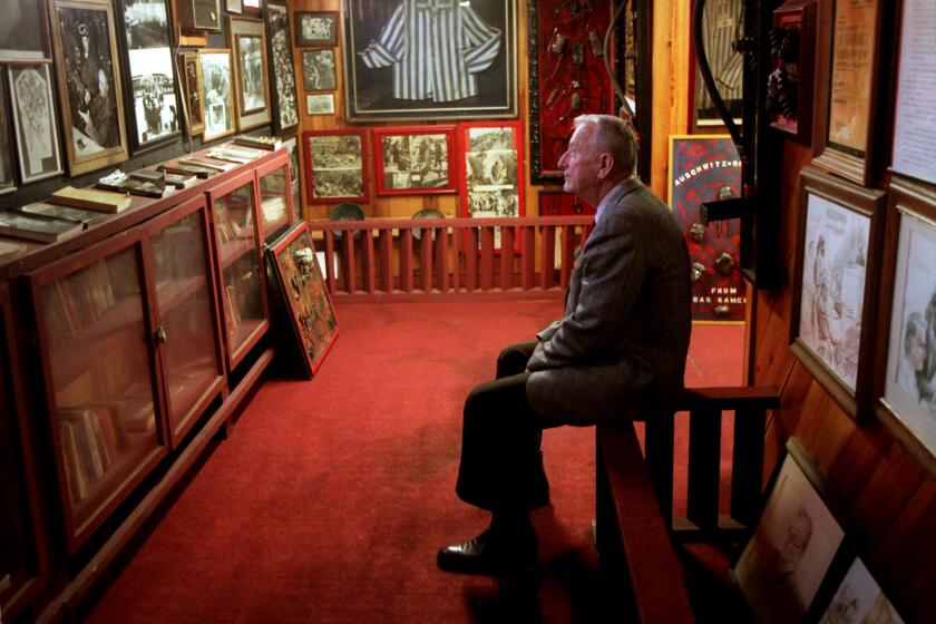 HUNTINGTON BEACH, CALIF. - MAR. 5, 1999 - Mel Mermelstein, founder of the Auschwitz Study Foundation, is photographed at his Huntington Beach museum exhibit. (Robert Lachman / Los Angeles Times)