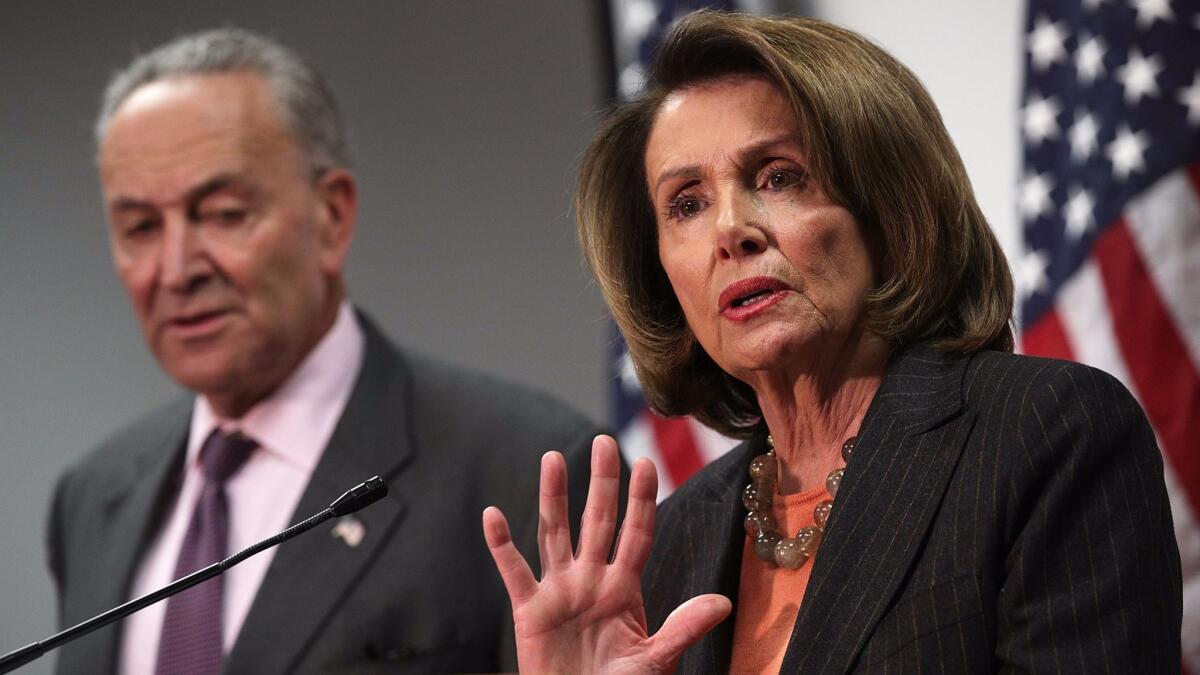 Sen. Charles E. Schumer (D-N.Y.) and Rep. Nancy Pelosi (D-San Francisco) speak at a news conference on the Republican tax proposals in Washington on Nov. 13.