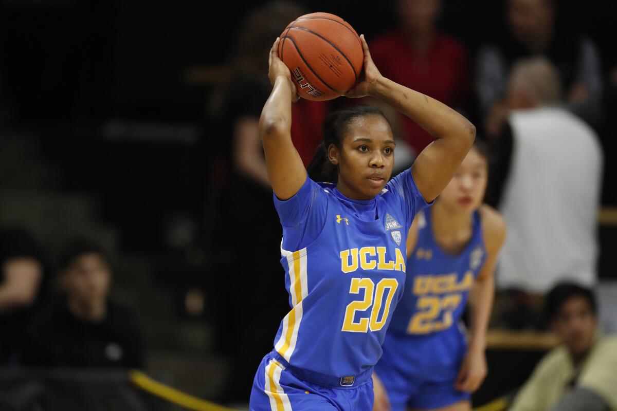 UCLA's Charisma Osborne makes a pass during a game against Colorado on Jan. 12, 2020.