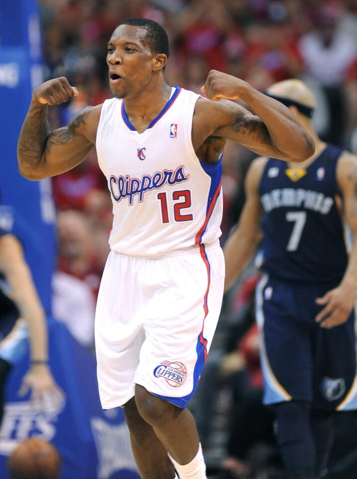 Clippers point guard Eric Bledsoe flexes after going coast to coast for a layup against the Grizzlies in the fourth quarter Saturday night at Staples Center.