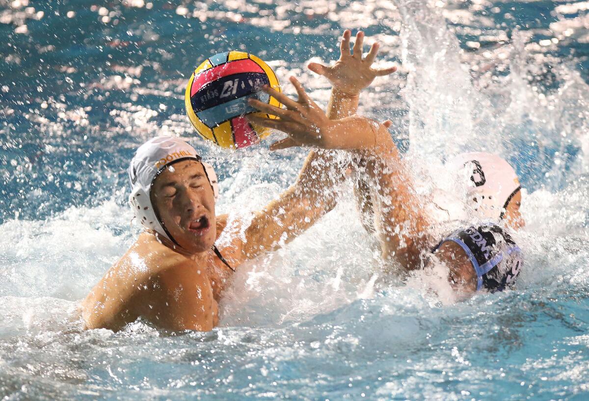 Corona del Mar's Gavin Reed (9) tries to get a shot off but it goes off the head of Foothill's Jackson Matos in the quarterfinals of the CIF Southern Section Division 2 playoffs on Saturday.