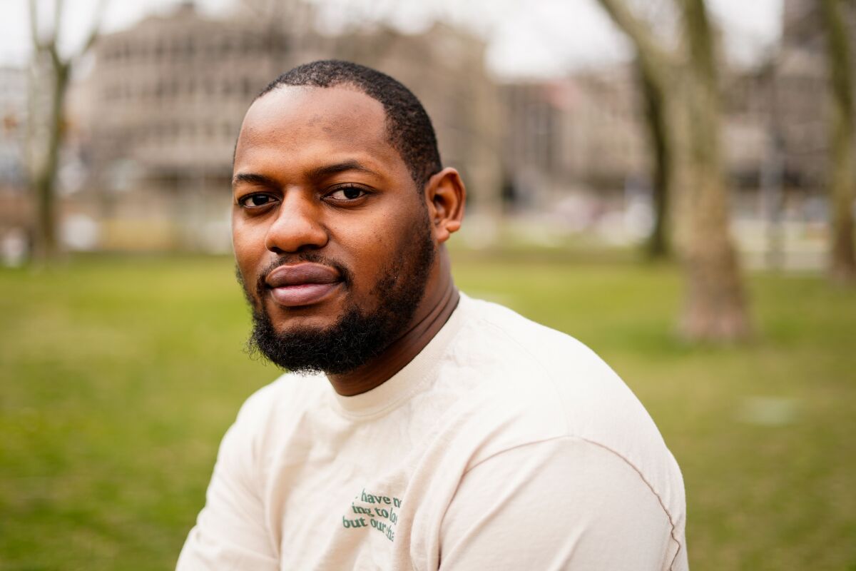 David Harrington poses for a photograph in Philadelphia, on Wednesday, March 23, 2022. Harrington spent a tense eight months in a Philadelphia jail when he was a teenager — the result of a robbery charge in 2014 that automatically sent his case to the adult court system under state law. (AP Photo/Matt Rourke)