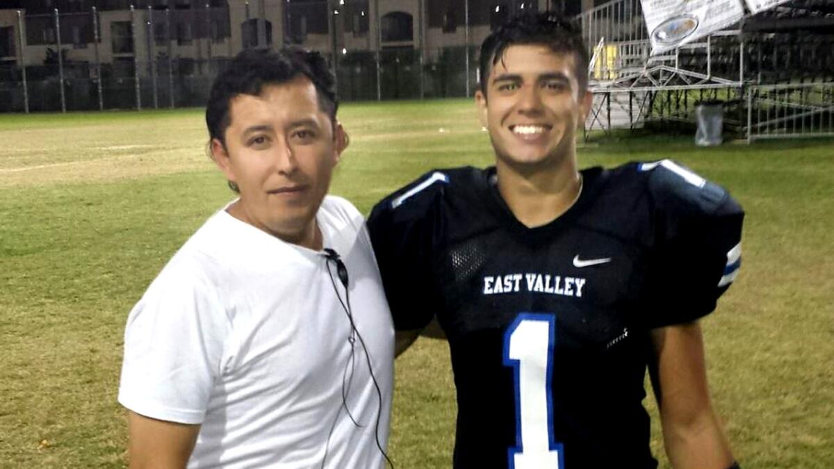 East Valley running back Joseph Hernandez (1) and his father, Adner Herrera.