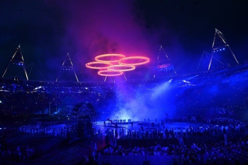 The Olympic rings assemble above the stadium in a scene depicting the Industrial Revolution during the opening ceremony of the London 2012 Olympic Games.
