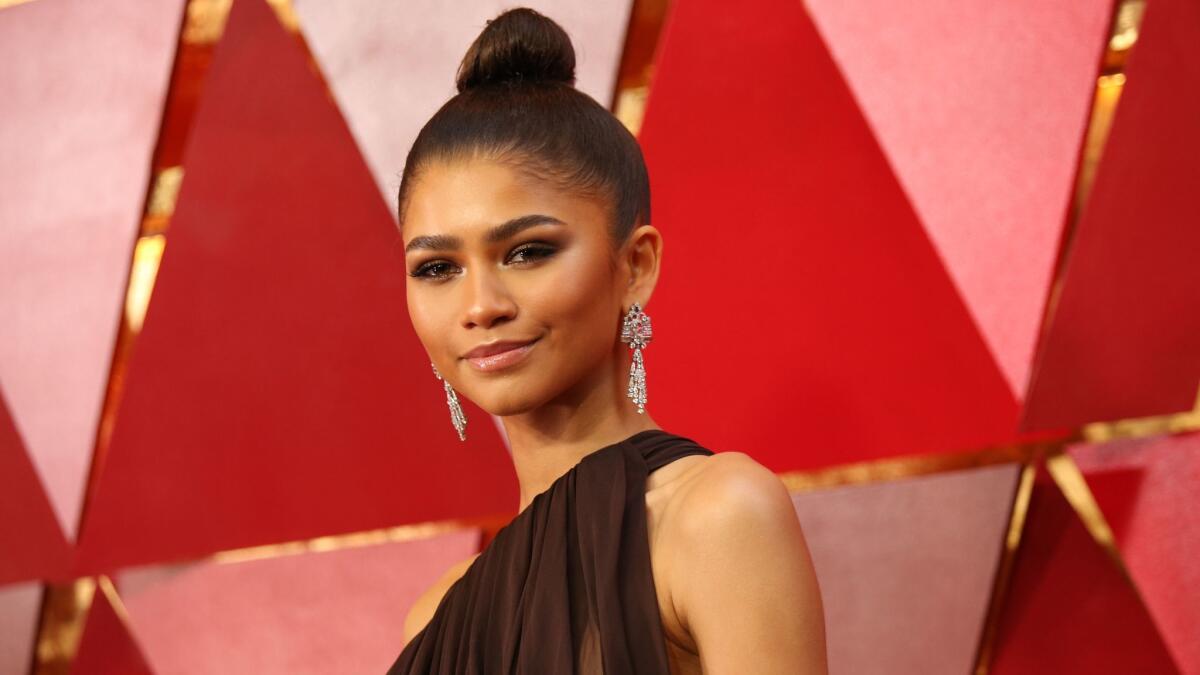 Zendaya's stylist and makeup artist describe her sleek look for the Oscars.