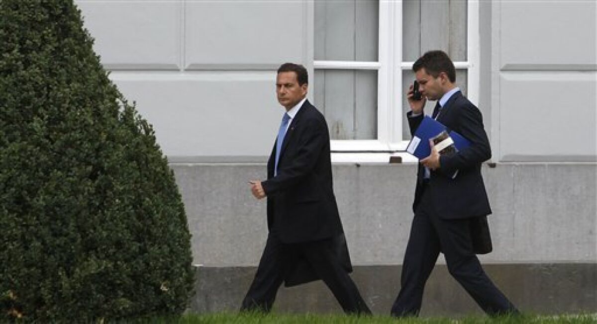 French Minister of Immigration Eric Besson, right, leaves a ministerial conference on the asylum process at the Egmont Palace in Brussels, Tuesday, Sept. 14, 2010. European Commission Vice President Viviane Reding today threatened France with legal action over the mass expulsions of Roma. (AP Photo/Virginia Mayo)