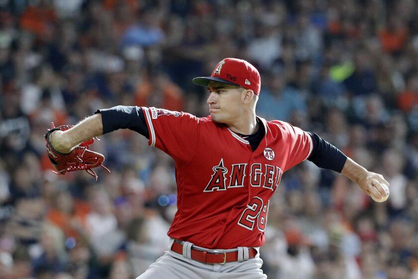 Los Angeles Angels starting pitcher Andrew Heaney throws against the Houston Astros during the first inning of a baseball game Saturday, July 6, 2019, in Houston. (AP Photo/David J. Phillip)