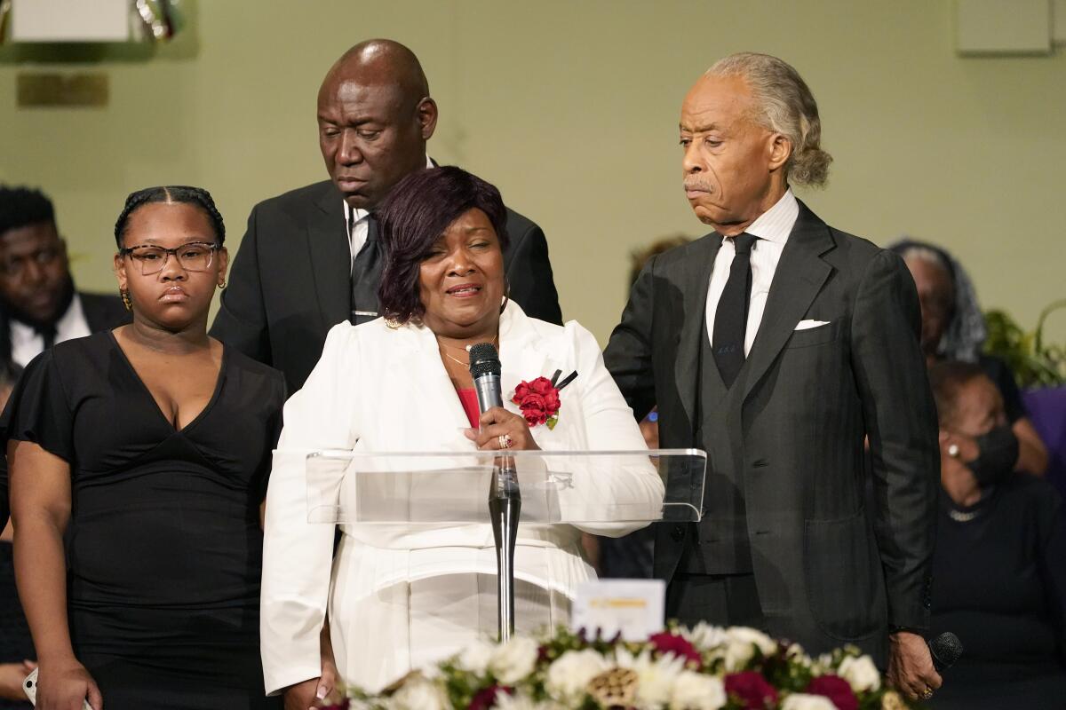 FILE -Bettersten Wade speaks to the attendees of her son Dexter Wade's funeral service in Jackson, Miss. Monday, Nov. 20, 2023. Looking on are the Rev. Al Sharpton, right, who delivered the eulogy, civil rights attorney Ben Crump, background, and one of her son's daughters, Jaselyn Thomas. Bettersten Wade, a woman who sued Mississippi's capital city over the death of her brother has decided to reject a settlement after officials publicly disclosed how much the city would pay his survivors, her attorney said Wednesday. (AP Photo/Rogelio V. Solis, File)