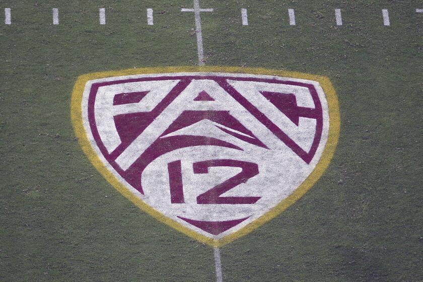 FILE - In this Aug. 29, 2019, file photo, the Pac-12 logo is displayed on the field at Sun Devil Stadium during an NCAA college football game between Arizona State and Kent State in Tempe, Ariz. The Pac-12 hired sports entertainment executive George Kliavkoff to be the conference's next commissioner on Thursday, May 13, 2021, replacing Larry Scott with a person with a similar resume short on college sports experience. (AP Photo/Ralph Freso, File)