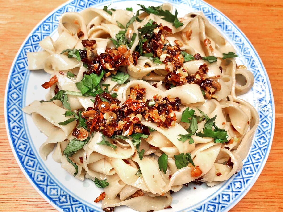 Wide noodles with chili crisp and cilantro