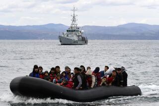 FILE - Migrants arrive with a dinghy accompanied by a Frontex vessel at the village of Skala Sikaminias, on the Greek island of Lesbos, after crossing the Aegean sea from Turkey, on Feb. 28, 2020. A much-anticipated report made public Thursday Oct. 13, 2022 by the European Union's anti-fraud watchdog into the alleged involvement of the EU border agency Frontex in the illegal pushbacks of migrants from Greece to Turkey has concluded that agency employees were involved in covering up such incidents in violation of peoples' "fundamental rights." (AP Photo/Michael Varaklas, File)