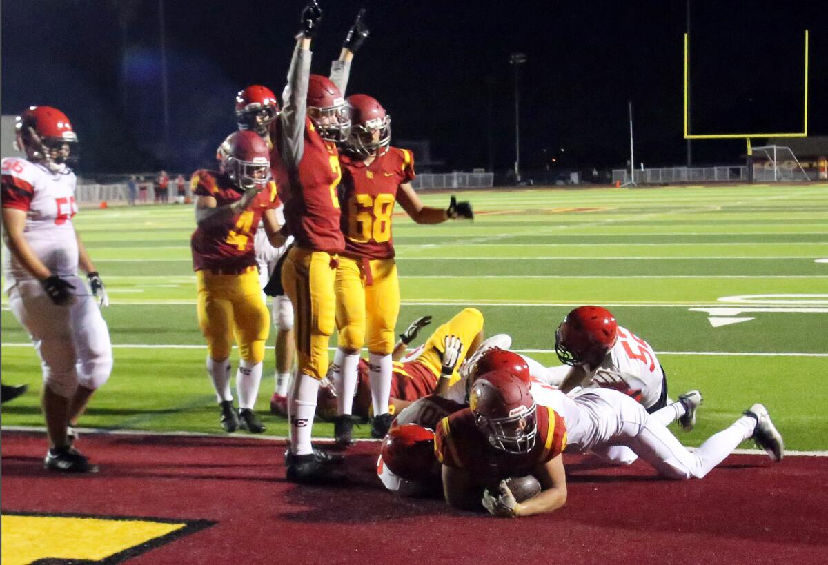 La Canada High's Jacob Hardy (21) scores at the end of the second quarter during La Canada High School boys football team against Glendale High School Boys football team in a nonleague game at La Canada High School in La Canada Flintridge, Ca., Saturday, August 31, 2019. (photo by James Carbone)