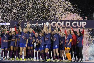 United States' Lindsey Horan holds the trophy alongside teammates after the United States defeated Brazil in the CONCACAF Gold Cup women's soccer tournament final match, Sunday, March 10, 2024, in San Diego. (AP Photo/Gregory Bull)