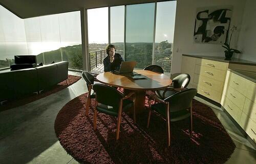 THE UNOFFICE: Andrew Winer works on his novel in the dining room, with its panoramic views: This place makes me feel a little more free.