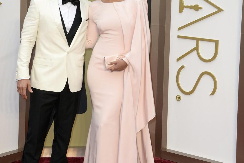 Matthew McConaughey and Camila Alves-McConaughey arrive for the Academy Awards ceremony.