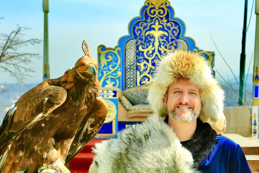 Randy "R Dub!" Williams gets into the garb in Kazakhstan en route to visiting every U.N.-recognized country in the world.