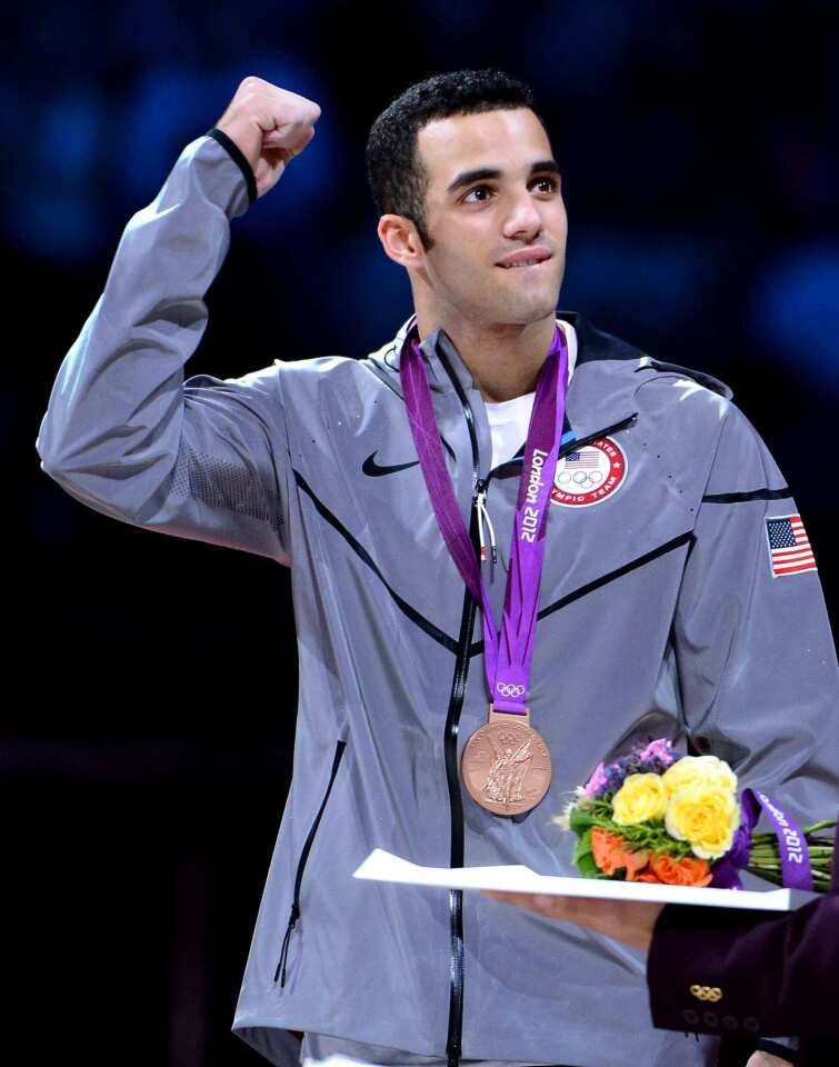 Team USA gymnast Danell Leyva celebrates his bronze medal in the men's individual all-around at the 2012 London Olympics.