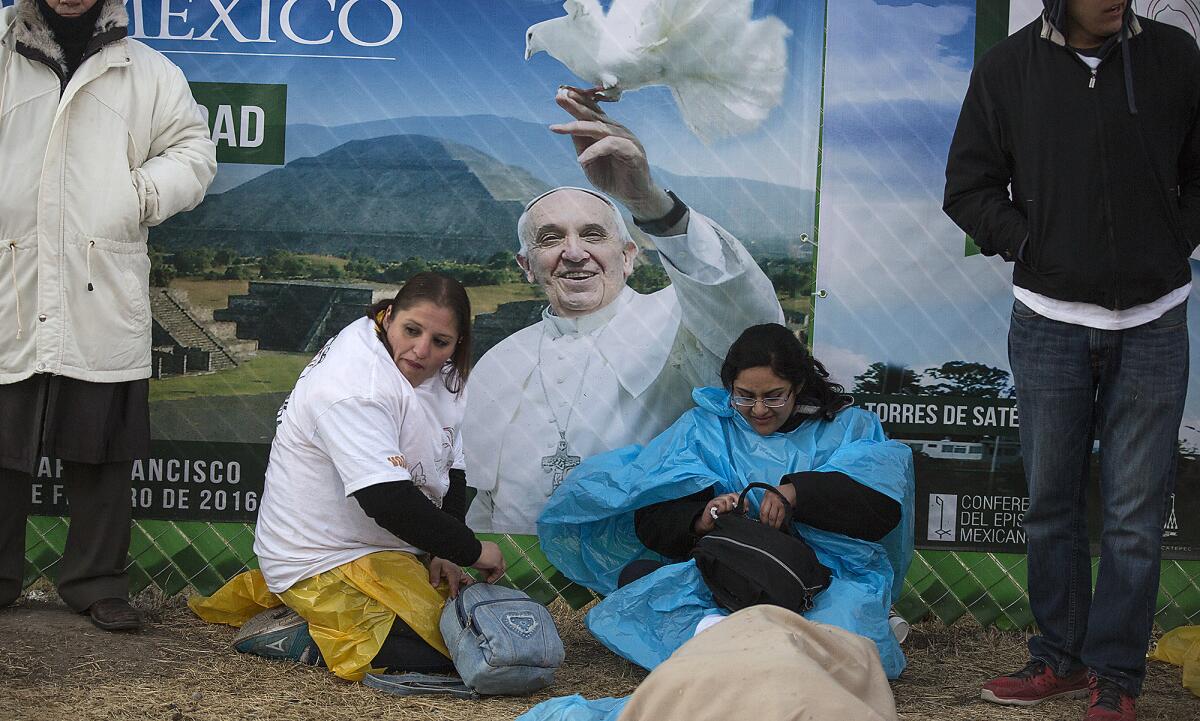 Hundreds slept outside overnight to wait for Pope Francis to arrive in Ecatepec, Mexico, on Feb. 14.