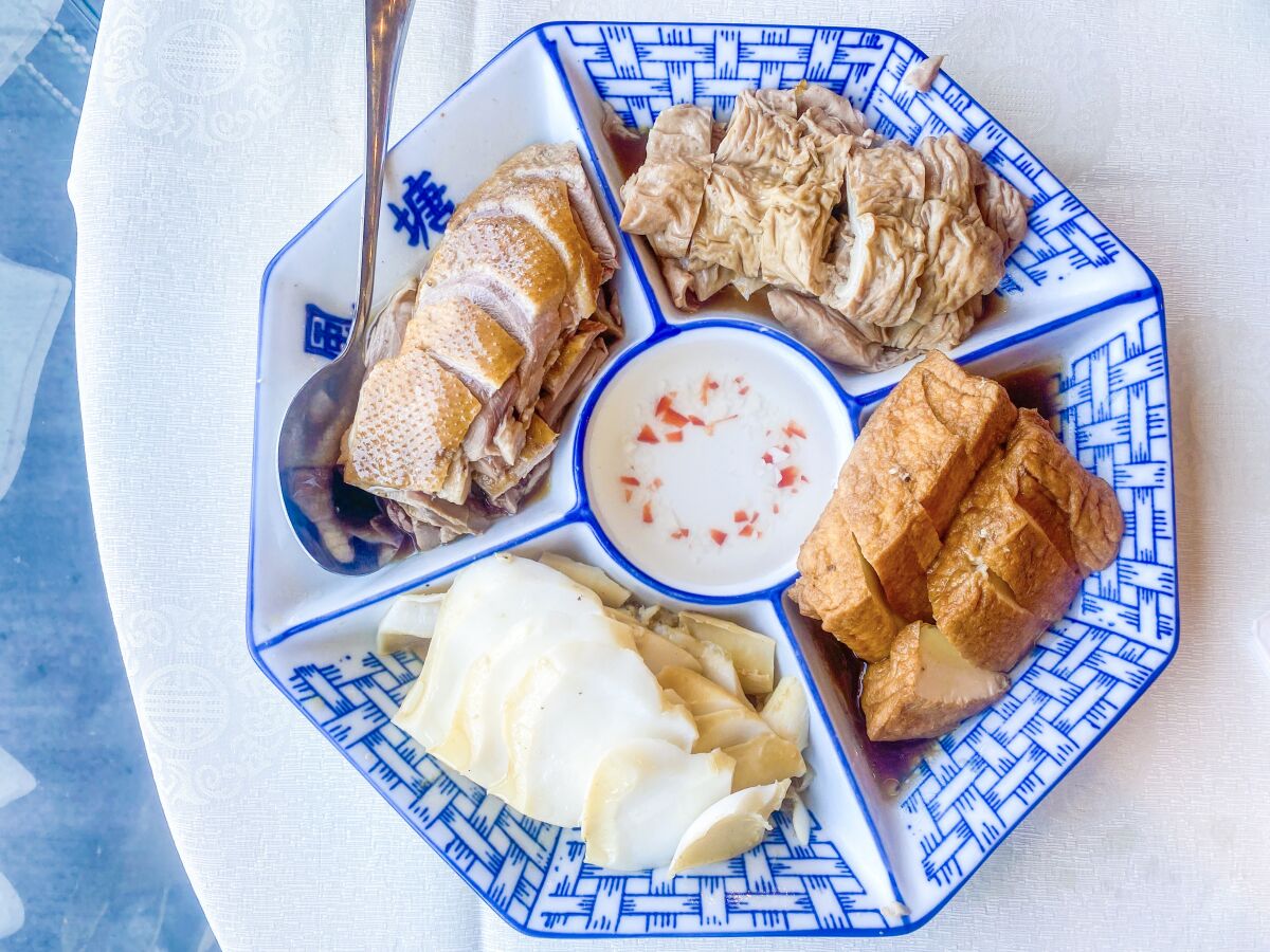 A platter with several types of sliced meats.