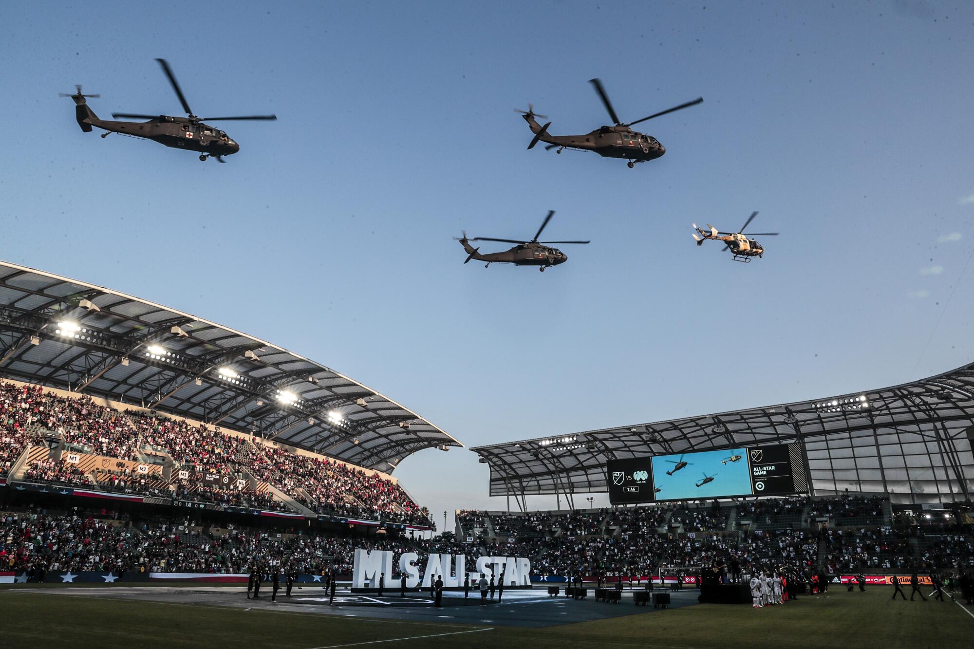 Helicopters fly over the stadium during pregame festivities as the MLS All-Star game