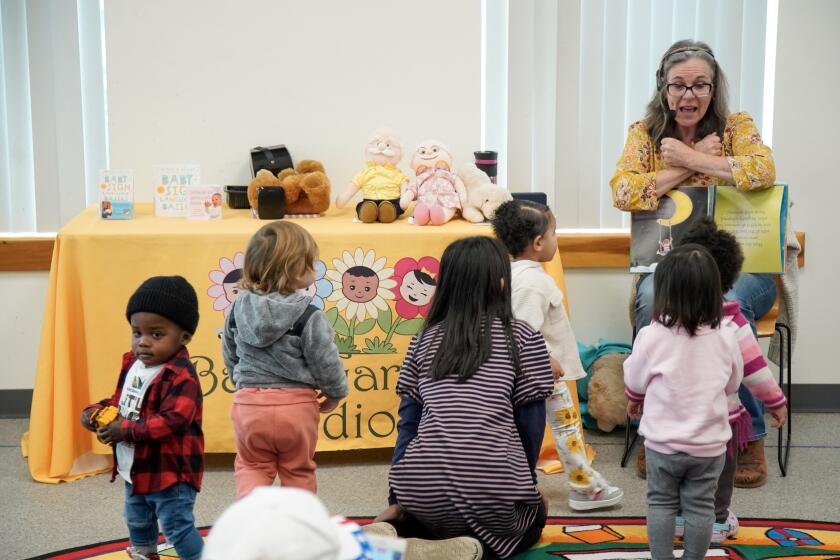 San Diego, California - February 16: Activities at City Heights Library are made possible by the new library equity program that shifts donation money from branches in high-income areas to branches in low-income areas. Monta Z. Briant lead instructor of Baby Sing Language Basics holds a class for toddlers and adults in City Heights on Friday, Feb. 16, 2024 in San Diego, California. (Alejandro Tamayo / The San Diego Union-Tribune)