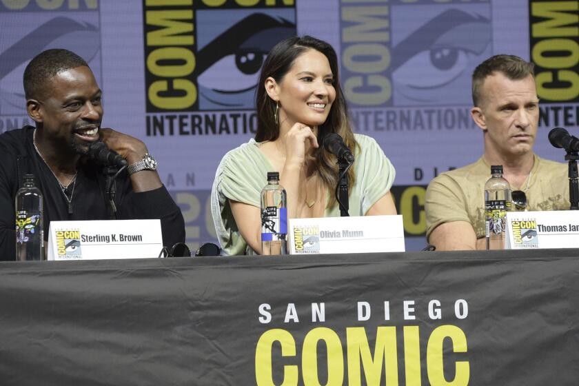 Sterling K. Brown, from left, Olivia Munn and Thomas Jane attend the 20th Century Fox "Predator" panel on day one of Comic-Con International on Thursday, July 19, 2018, in San Diego.(Photo by Richard Shotwell/Invision/AP)