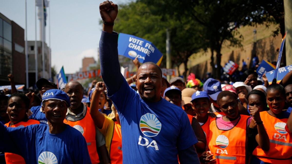 Thousands of Democratic Alliance (DA) party members march through the streets of downtown Johannesburg during a protest march against South African President Jacob Zuma on April 15.
