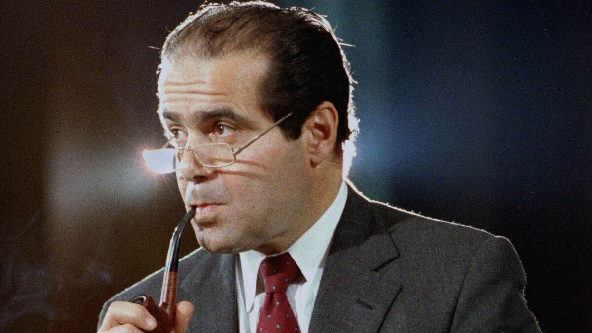 In this Aug. 6, 1986 file photo, Supreme Court Justice nominee Antonin Scalia attends a Senate Judiciary Committee during his confirmation hearings in Washington.