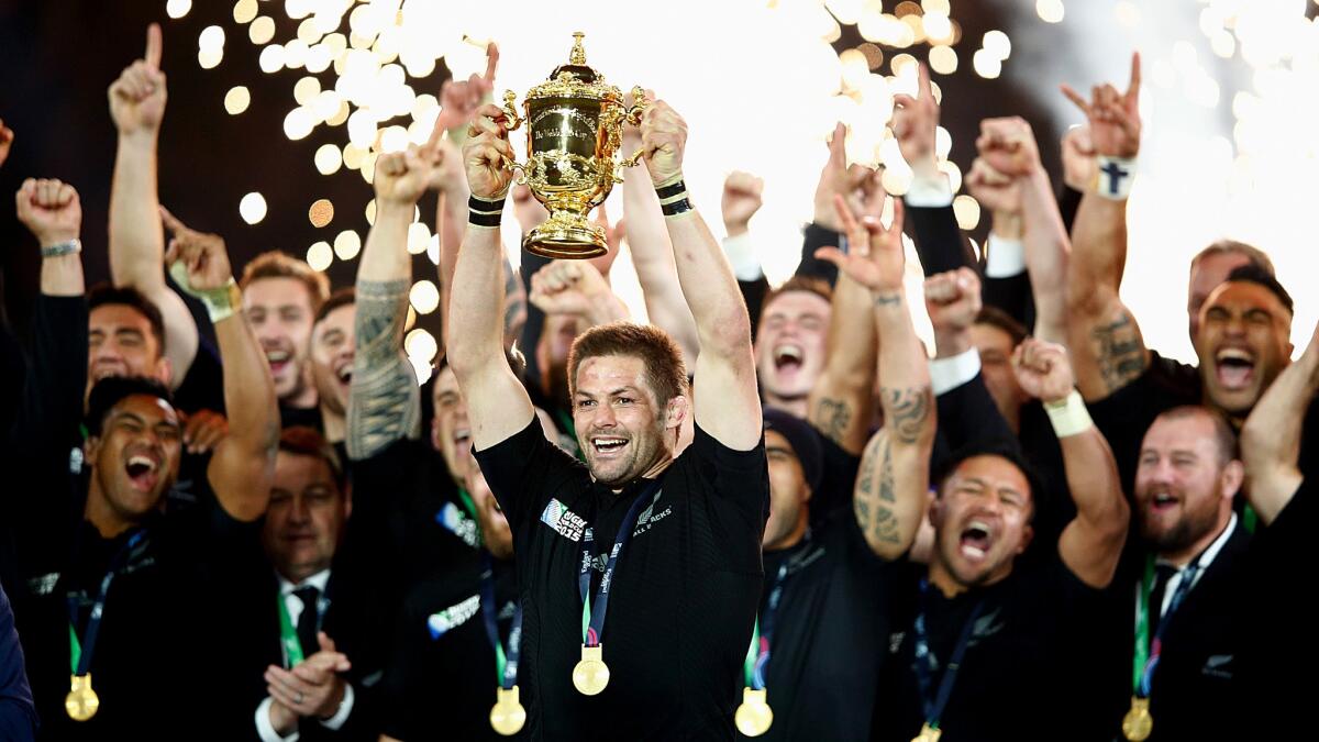 Captain Richie McCaw hoists the Web Ellis Cup after New Zealand defeated Australia in the Rugby World Cup final Saturday.