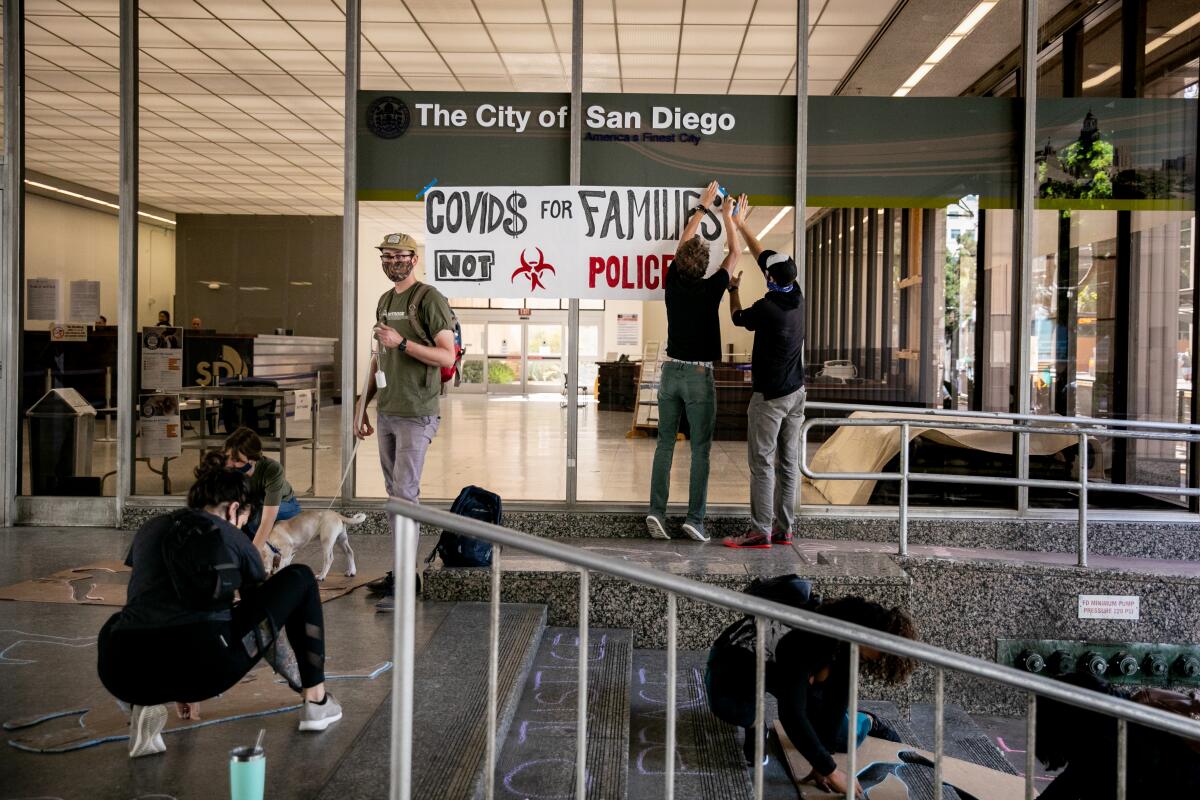 Protesters gather outside San Diego City Hall on Monday.