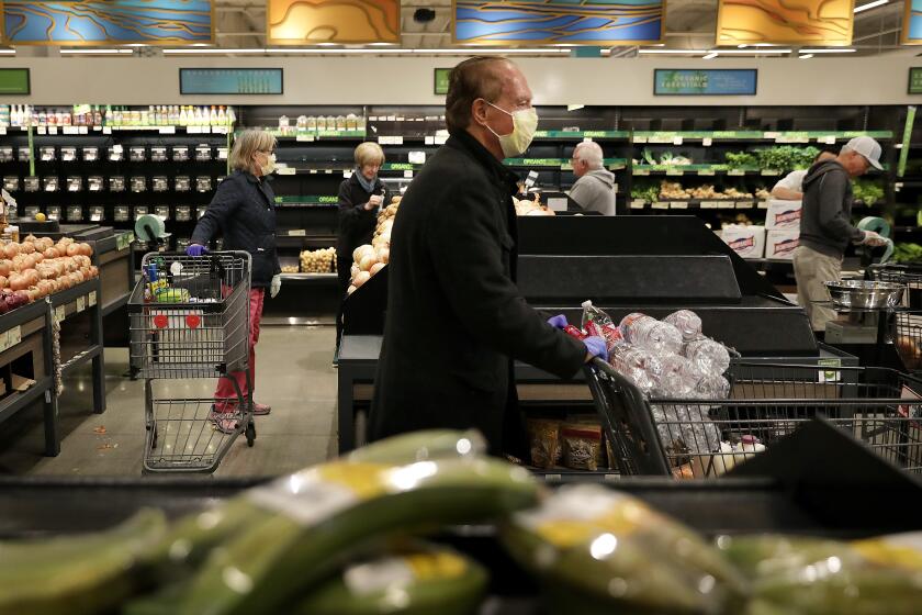 MANHATTAN BEACH-CA-MARCH 18, 2020: Seniors shop at Gelson's Market in Manhattan Beach on Wednesday, March 18, 2020. The store is doing a "seniors shopping hour" where seniors can go grocery shopping before anybody else. (Christina House / Los Angeles Times)