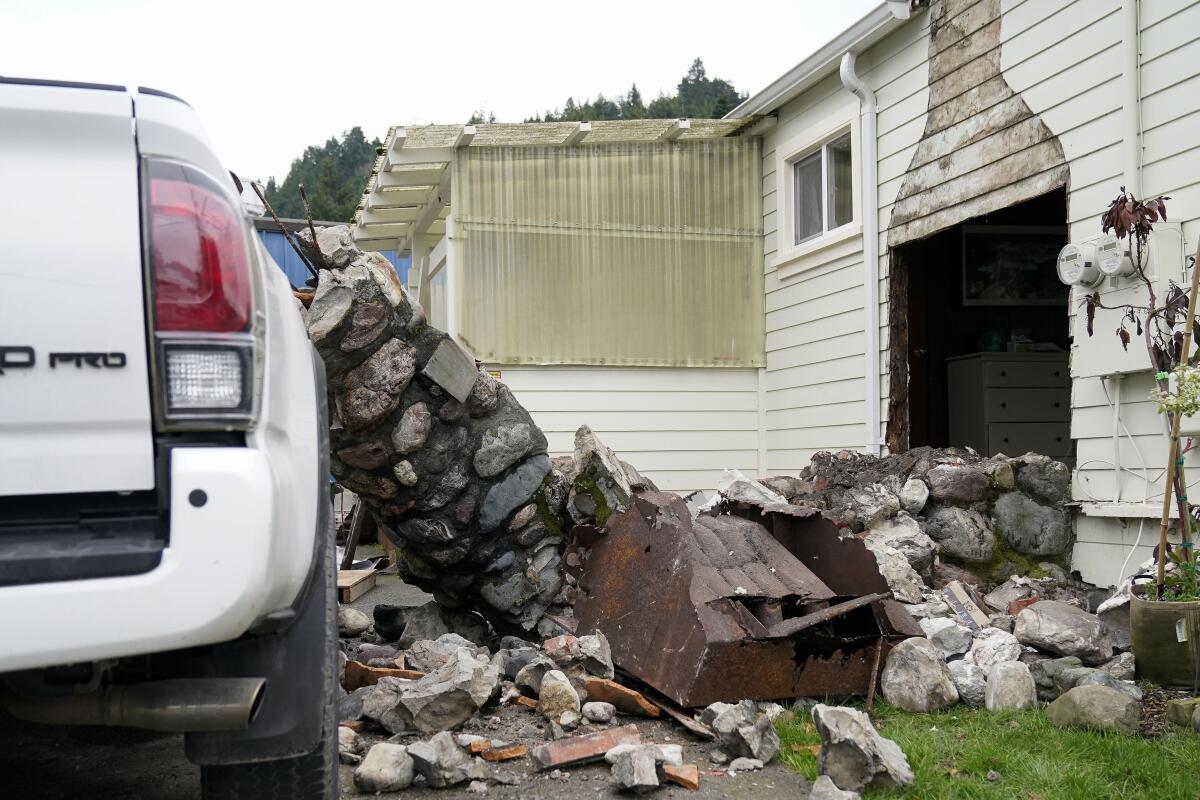 A chimney is toppled out of a home after an earthquake.
