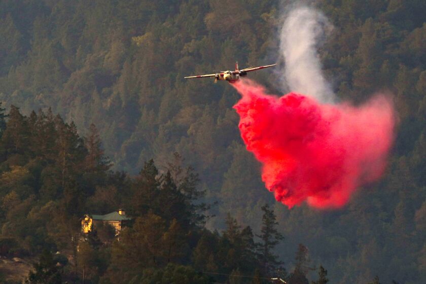 Firefighting aircraft make retardant drops on the Glass fire in Napa County