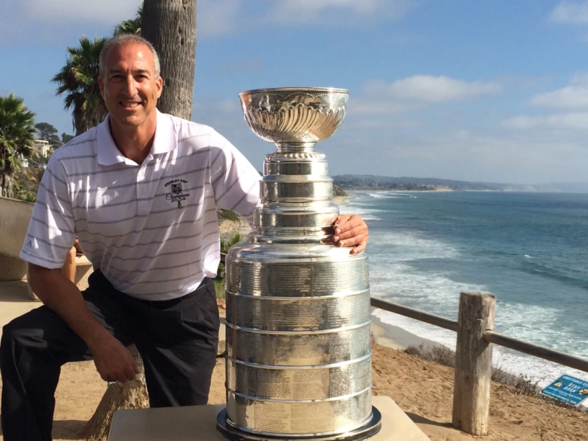Jeff Solomon poses with the Stanley Cup.