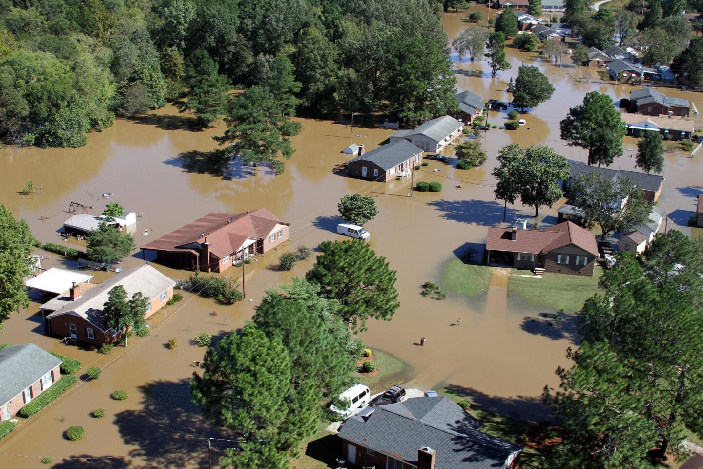 Floodwaters surround houses in Rocky Mount, North Carolina, near the Tar River on Oct. 10, 2016.