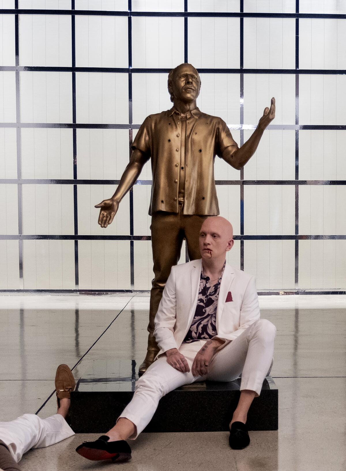 NoHo Hank collapses near the statue of his lover as he dies in the "Barry" finale.
