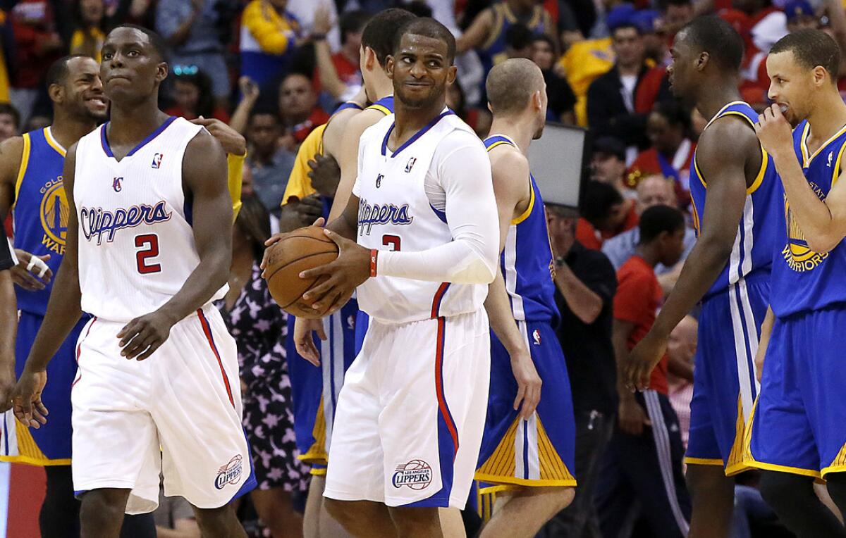 Clippers point guard Chris Paul casts a look toward the referees in the final seconds of a 109-105 loss to the Golden State Warriors on Saturday at Staples Center.