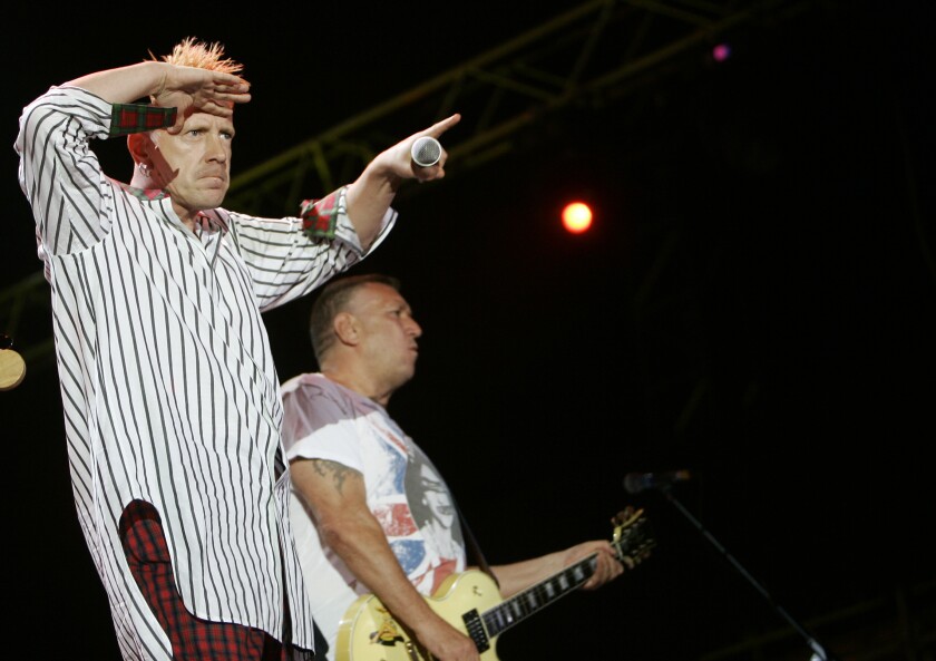 FILE - In this file photo dated Monday, July 14, 2008, John Lydon, left, and Steve Jones of British band the Sex Pistols perform during the Exit music festival in Novi Sad, Serbia. Former members of the Sex Pistols Guitarist Steve Jones and drummer Paul Cook, are suing singer Johnny Rotten for the right to use the band’s songs in an upcoming television series "Pistol" about the anarchic punk icons, based on a memoir by Jones. (AP Photo/Darko Vojinovic, FILE)