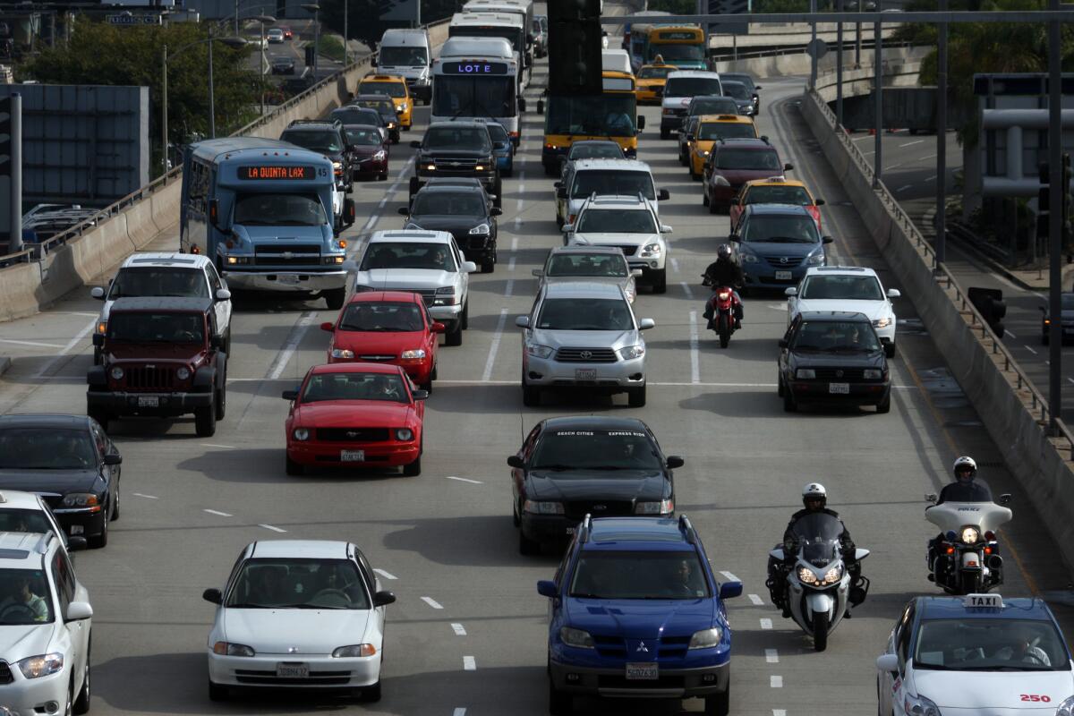 The upper roadway at Los Angeles International Airport is jammed with traffic on a busy travel day. Major repairs have been approved for the elevated structure around the central terminal area.