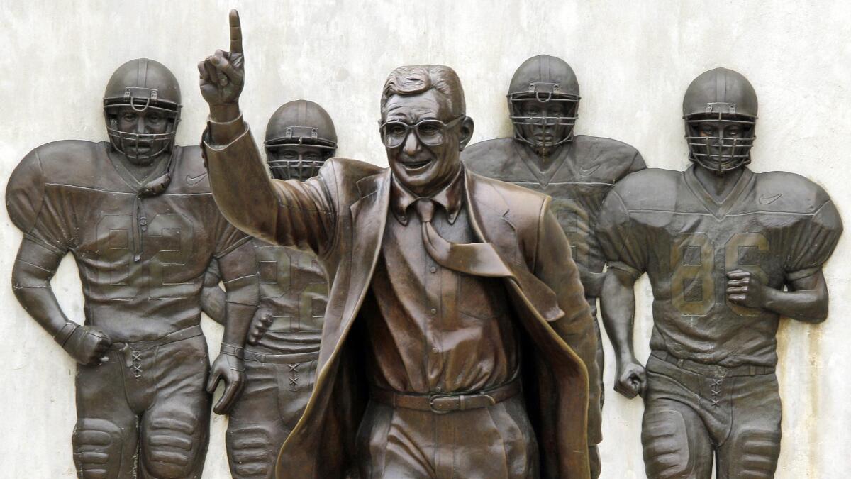A statue of former Penn State football coach Joe Paterno stands outside Beaver Stadium on the campus of Penn State University in July 2012.
